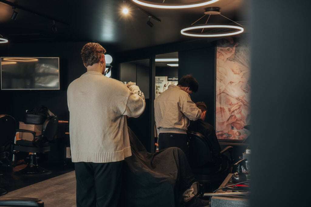 Barber at work during cinematic brand film shoot for Monton Barbers
